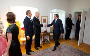 The President of Iceland greets Mr. Sandor Liive.