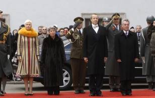 Austria's President Heinz Fischer, Estonian President Toomas Hendrik Ilves, Austria's First Lady Margit and Estonia's First Lady Evelin listen to their national anthems during an official visit in Vienna November 23, 2010.