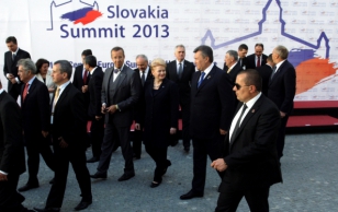 Heads of state progressing from photo shoot to the summit.